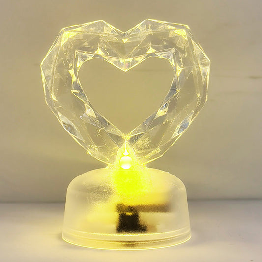 Corazón plástico tipo cristal con luz