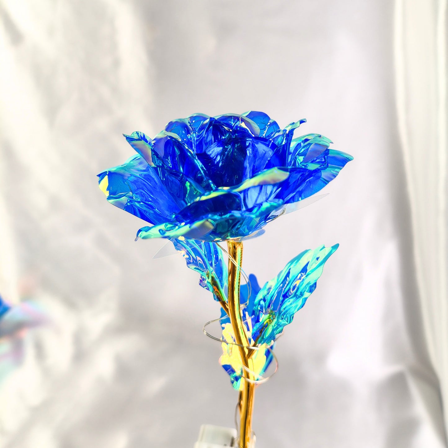 Rosa eterna tornasol con luz